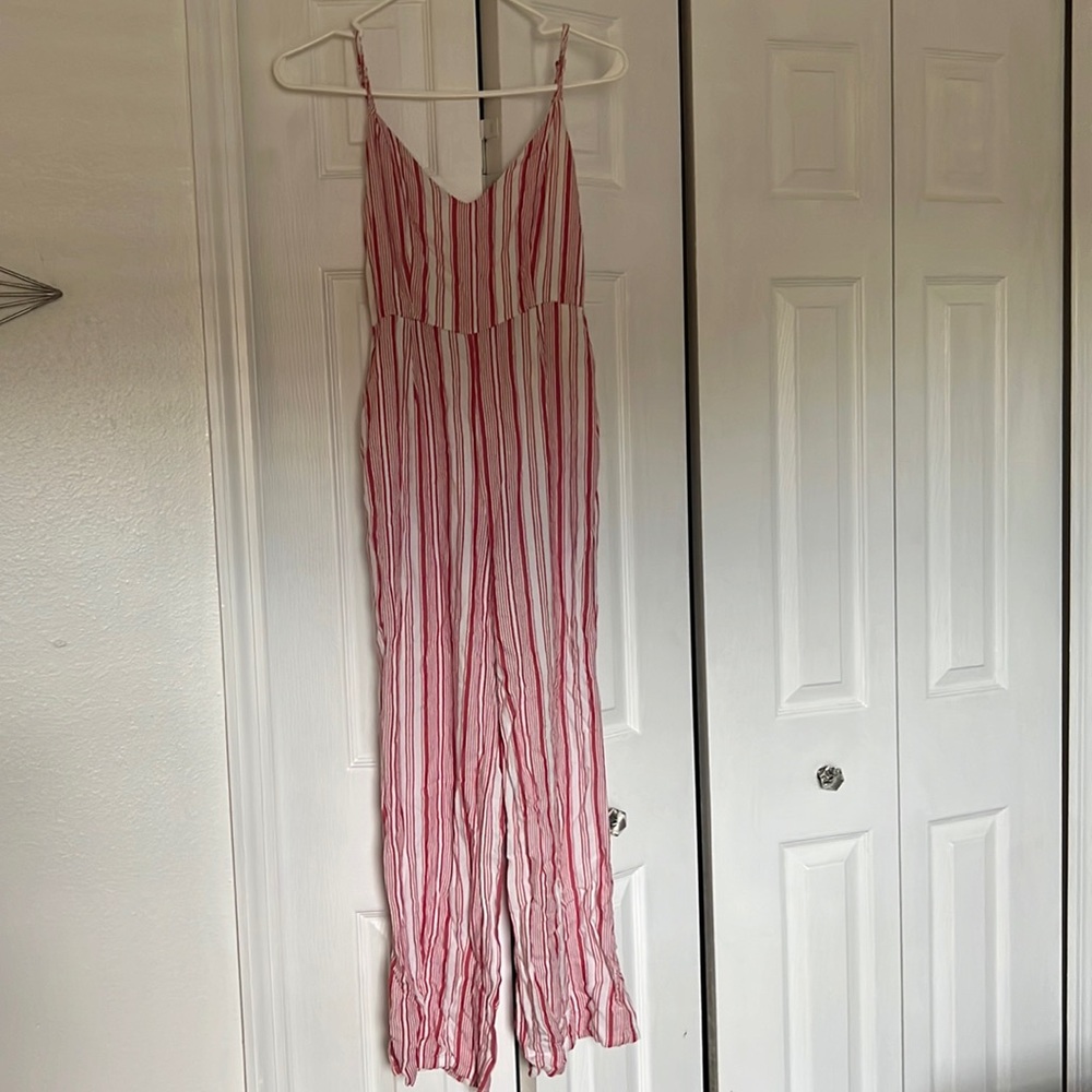White and pink jump suit. Size x-small.
